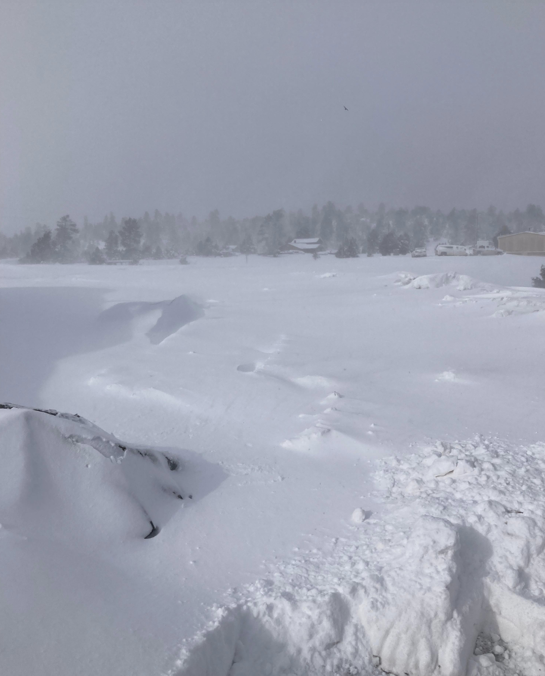 Snow-covered land and homesteads near Teec Nos Pos, Arizona
